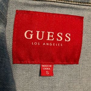 Adorable Guess Jean jacket with distressed light blue material.